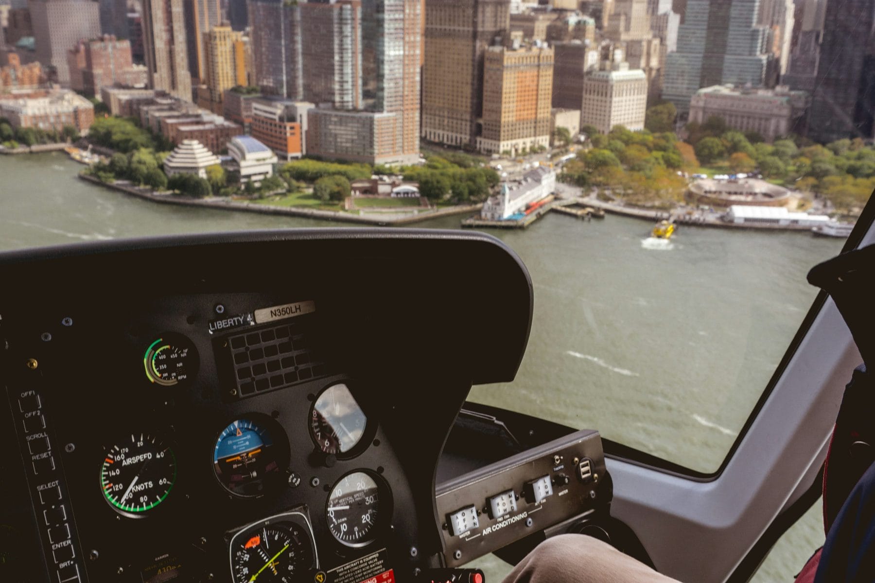 Helicopter cockpit over the Manhattan skyline