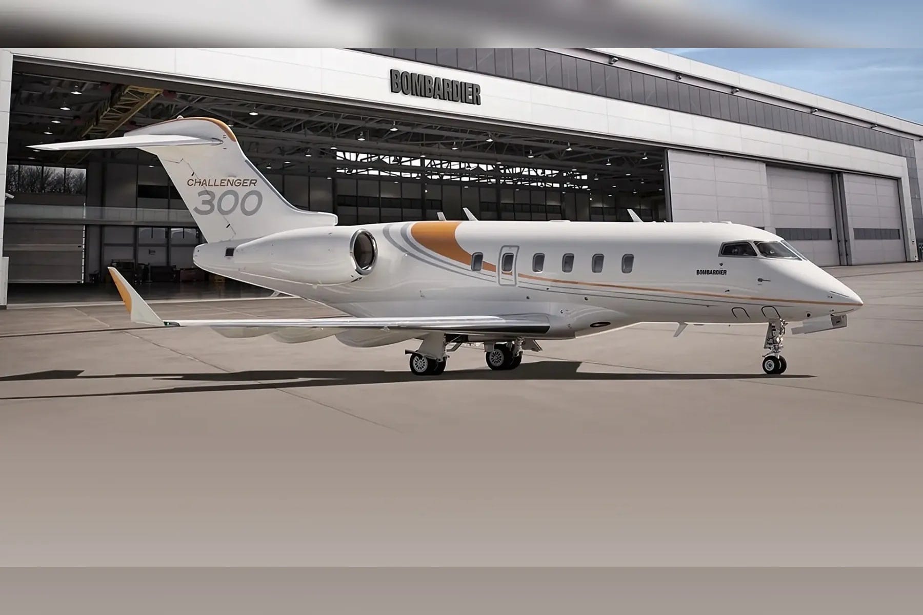 A Bombardier Challenger 300 parked outside a Bombardier hangar