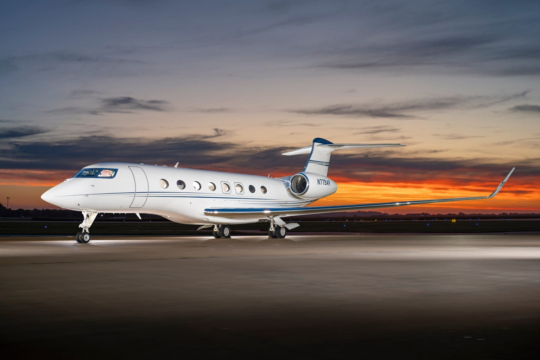 A Gulfstream G650 ultra-long-range jet on the ramp at sunrise